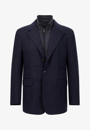 Merivoimien sininen bleiseri, jossa untuvatäytteinen vuori, kaksi etutaskua, yksirivinen malli ja napilliset suljenta.