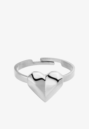 Silver open band ring with a polished geometric heart shape at the center on a white background.