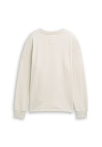Crème-kleurige sweatshirt van een textuurstof, met een ronde halslijn en lange mouwen. Beschikt over een klein vierkant patch op de achterkant.