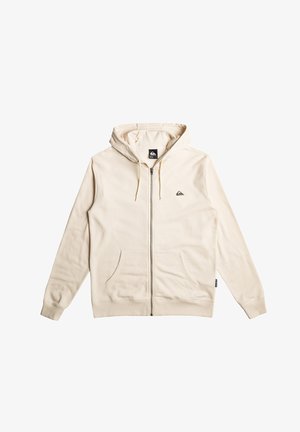 Cremfarbener Reißverschluss-Hoodie mit einer Kordelzugkapuze, Kängurutaschen und einem kleinen Logo auf der linken Brust. Glatte Textur, lässiges Design.