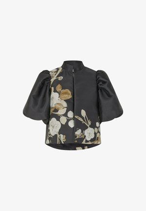 Juoda bluzonė su pūstomis rankovėmis, gėlių raštas kreminės ir baltos spalvos. Yra aukštas apykaklė ir priekinis užtrauktukas. Lygus, glotnus paviršius.