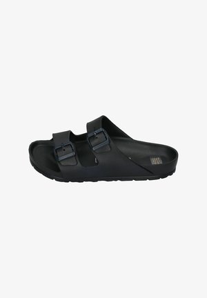 Black sandals made of flexible material, featuring two adjustable buckles, a contoured footbed, and a textured outsole for grip.