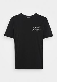 Black short-sleeve t-shirt made of cotton, featuring a white cursive print of the words "good vibes" on the left chest area.