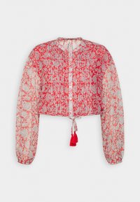 Blusa trasparente a maniche lunghe con motivo floreale rosso e bianco, bottoni frontali, vita arricciata e dettaglio con nappine sull'orlo.