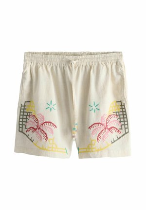Béžové šortky so sťahovacou šnúrkou, vyšívané ružovými a červenými palmami, žltými geometrickými tvarmi a tyrkysovými hviezdicovitými detailmi na každej nohe.