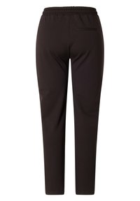 Zwarte, elastische broek met een elastische tailleband, smal in de pasvorm en een enkele achterzak. Glad textuur, geen zichtbare patronen of hardware.