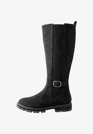 Botte haute en cuir noir avec panneau latéral élastique texturé et boucle argentée décorative, semelle robuste pour une utilisation extérieure.