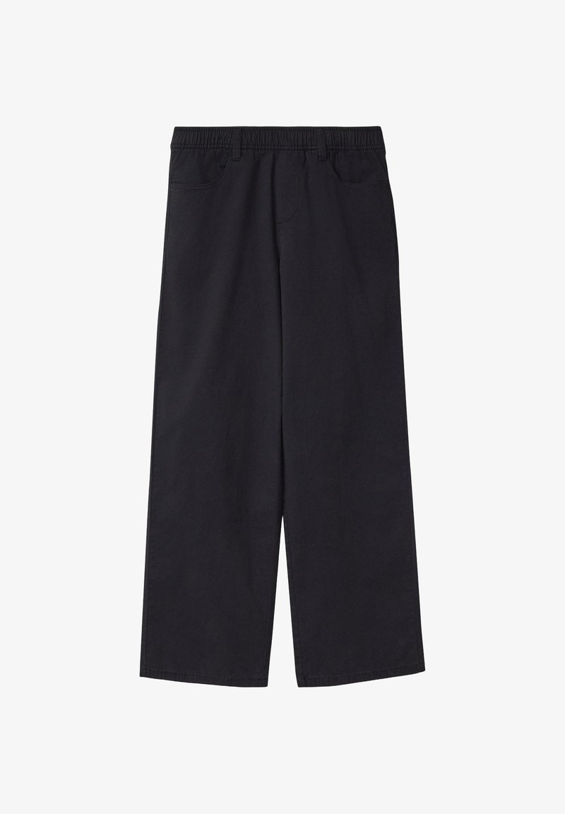 Pantalon noir à jambes larges avec taille élastique et poches avant, en tissu lisse.