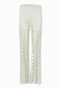 Pantaloni larghi in pizzo di colore avorio con vita in maglia. Il tessuto presenta un motivo floreale con dettagli a intaglio in tutto.