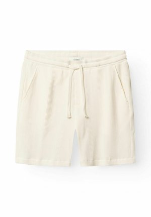 Cream textured knit shorts with an elastic waistband, drawstring tie, and side pockets, laid flat against a white background.
