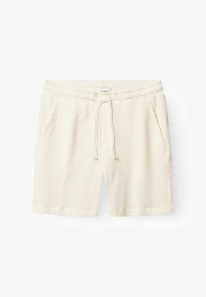 Cream textured knit shorts with an elastic waistband, drawstring tie, and side pockets, laid flat against a white background.