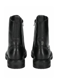 Black leather ankle boots featuring a smooth texture, two side zippers, and a durable sole with stitching detail.