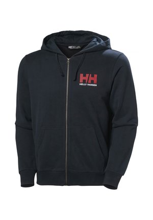 Námořnická mikina na zip vyrobená z měkké tkaniny, která má přední kapsu a červené logo "HH". Pohodlný střih s nastavitelnou kapucí na šňůrku.