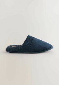 Navy blue slipper with a soft, textured fabric upper, padded interior, and a pointed toe design, featuring a subtle logo on the side.