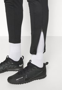 Nike Performance ACADEMY PANTS - Spodnji deli trenirk - black/bright crimson