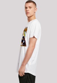 White cotton t-shirt featuring colorful graphic design on the front. Short sleeves and relaxed fit with a crew neck. Simple collar.
