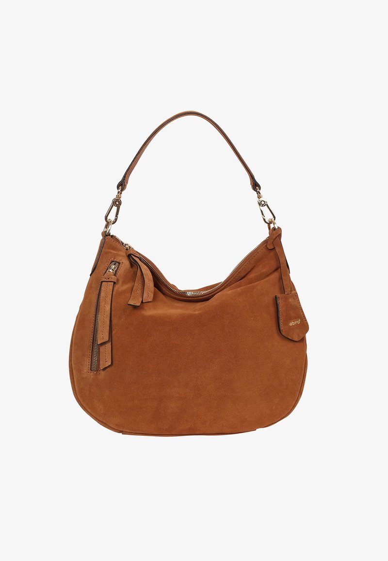 Braune Wildleder-Handtasche mit geschwungener Silhouette, einem einzelnen Schulterriemen und einer vorderen Reißverschlusstasche. Ausgestattet mit goldfarbenen Details und einem Troddel.