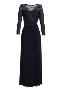 Námořnické šaty s krajkovým korzetem a dlouhými rukávy, s drapovanou sukní a volánkovým výstřihem na jedné straně. Celkově hladká textury.