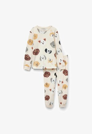Cotton pajamas featuring long sleeves and elastic cuffs, adorned with colorful dog faces on a cream background. Pants match the top.