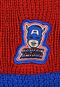 Red knitted beanie featuring a blue embroidered patch of a character with a blue mask and the text "CAPTAIN AMERICA" in black and white.