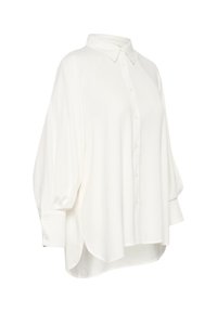 Vit oversized skjorta med knappar, krage och långa ärmar, med en mjuk, slät textur och rundad nederkant.