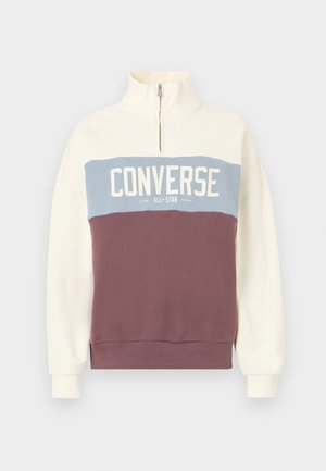Sweatshirt ușor din fleece cu fermoar pe jumătate. Prezintă blocuri de culori crem, albastru deschis și vișiniu. Textul logo-ului tipărit pe piept.