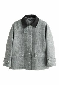 Harmaa herringbone-takki mustalla farkkukollarilla, nepparilla ja kahdella etutaskulla. Kankaan pinta on tekstuuri- ja kuviomaisempi.