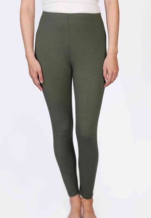 Olivegrüne Leggings aus einem dehnbaren Stoff, mit glatter Textur und hohem Bund. Entwickelt für Komfort und Flexibilität.