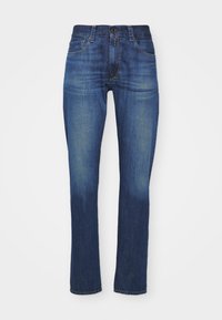 Mörkblå denimjeans, slim fit med en klassisk femfickedesign, med dragkedja och knappstängning, samt subtila blekningar.