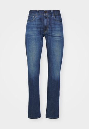 Donkerblauwe spijkerbroeken in slim fit met een klassiek vijf-pocket ontwerp, voorzien van een ritssluiting en knoopsluiting, en lichte vervaging.