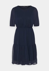 Sinih navy'lla polvili, lyhyt-hiha nostovöidä, kerroksellinen hame ja läpinäkyvä kangas päällimmäisenä.