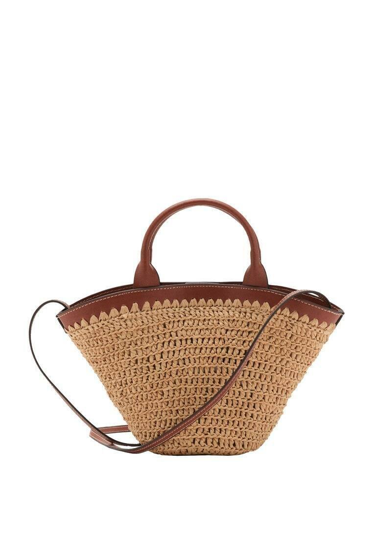 Woven straw handbag in tan with a brown synthetic leather trim, featuring two short handles and a long adjustable strap.