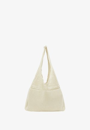 Stricktasche in cremefarben mit einem strukturierten, netzartigen oberen Teil und festem Boden. Sie verfügt über einen einzelnen, breiten Tragegurt.