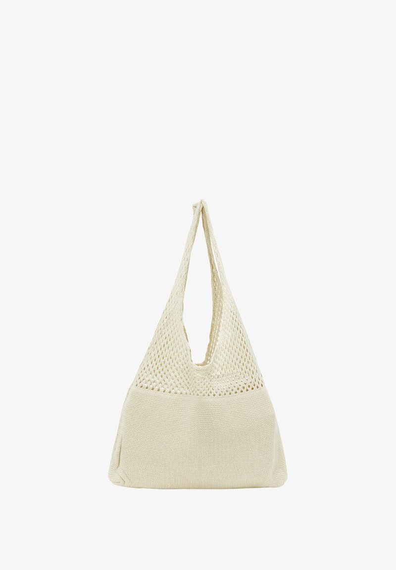 Szydełkowa torba w kolorze kremowym z teksturowanym, siatkowym górnym częścią i solidnym dnem. Posiada jeden szeroki pasek do noszenia.