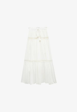 Jupe midi blanche en coton avec un design à volants, dotée d'une taille smockée et d'accents en dentelle. Tissu léger et texturé.