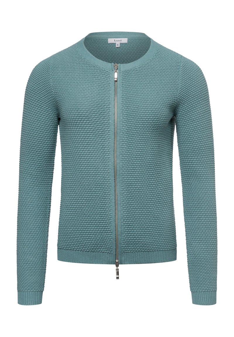 Stickad zip-up cardigan i teal, med en texturerad mönster, rund halsringning och ribbade ärmslut och nederkant. Dragkedjan sträcker sig till kragen.