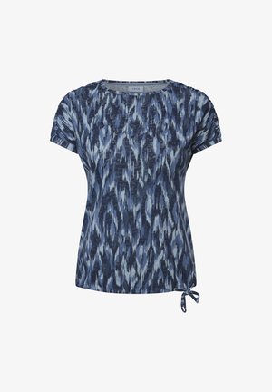 Sininen kuvioitu lyhythihainen t-paita, jossa on abstrakteja tekstuureja, pyöreä kaula-aukko ja solmittava yksityiskohta helmassa säätömahdollisuutta varten.