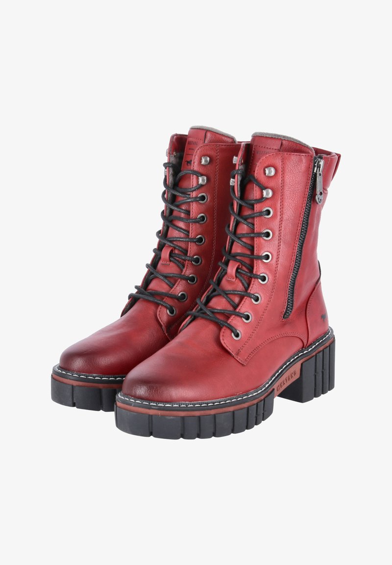 Red leather ankle boots with a textured finish, featuring black laces, a side zipper, and a thick, layered black rubber sole.
