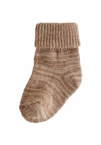 Gestrickte Socke in Brauntönen, mit einem gerippten Bund und einem strukturierten Körper mit einem dezenten Muster. Weiches, warmes Material.