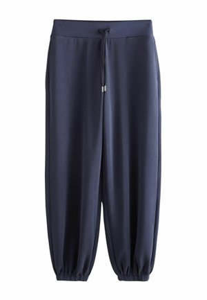 Pantalon de jogging décontracté bleu marine avec taille élastique, cordon de serrage, poches latérales et poignets élastiques aux chevilles sur fond blanc.