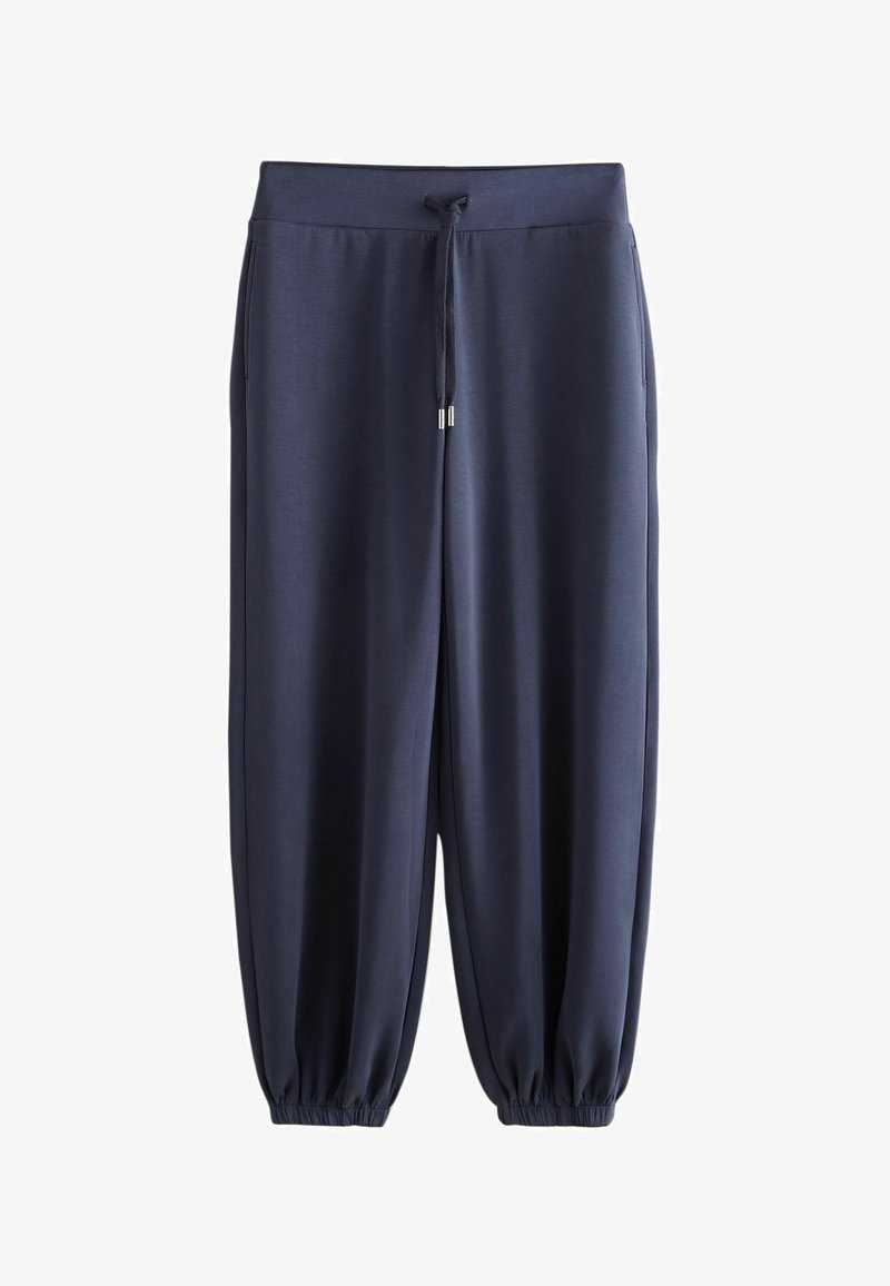 Pantalon de jogging décontracté bleu marine avec taille élastique, cordon de serrage, poches latérales et poignets élastiques aux chevilles sur fond blanc.