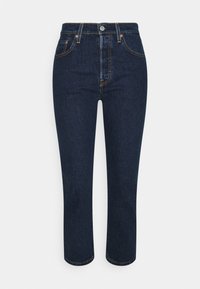 Jeans de mezclilla azul oscuro con una cintura alta, diseño de pierna recta, costuras visibles y detalles en los bolsillos frontales. Terminados con un cierre de cremallera.