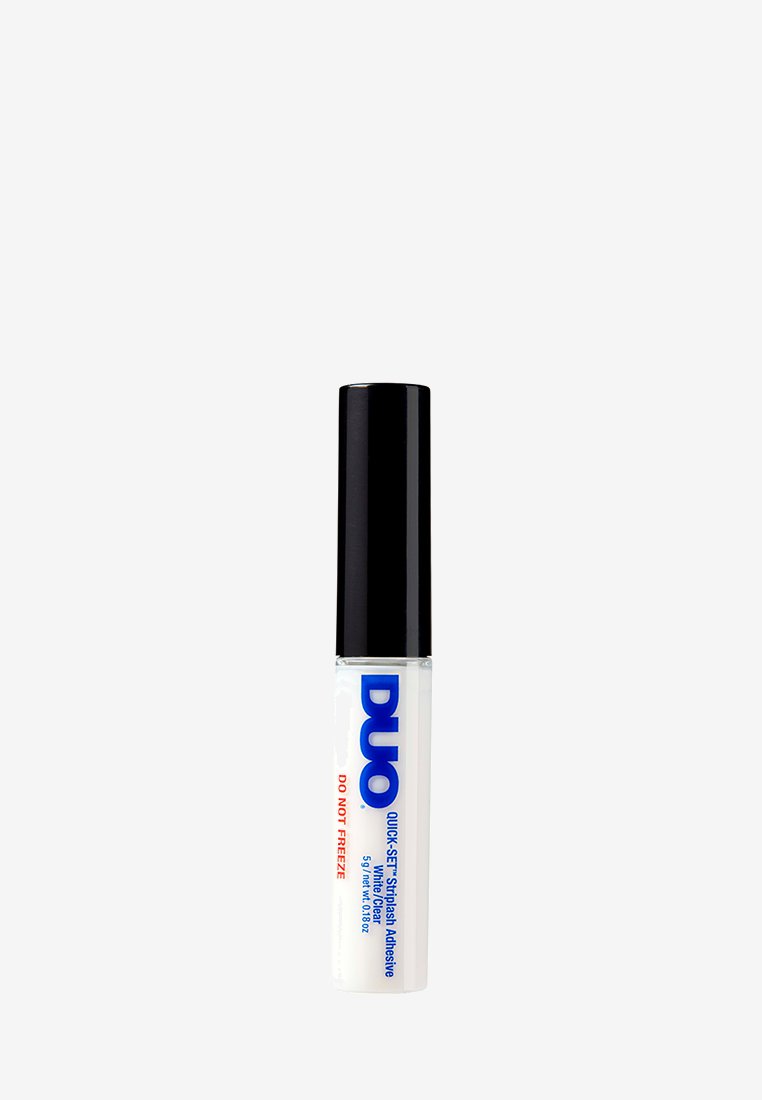 White adhesive tube with black cap. Blue and red text reads "DUO QUICK-SET StripBash Adhesive." 15ml size indicated on label.