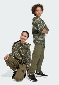 adidas Performance FUTURE ICON - Pantalones deportivos - olive strata   black