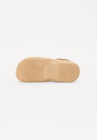 Tan rubber sandal sole with a textured grip pattern featuring geometric shapes and the size "37" embossed in the center.
