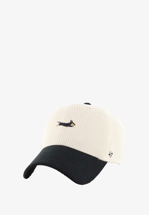 Two-tone corduroy baseball cap with cream crown, black curved brim, and embroidered small black and brown dachshund dog on front.