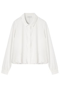 Biała przycięta bluzka z klasycznym kołnierzem, długimi rękawami, zapięciem na guziki z przodu i subtelnym połyskiem. Gładka tkanina o luźnym kroju.