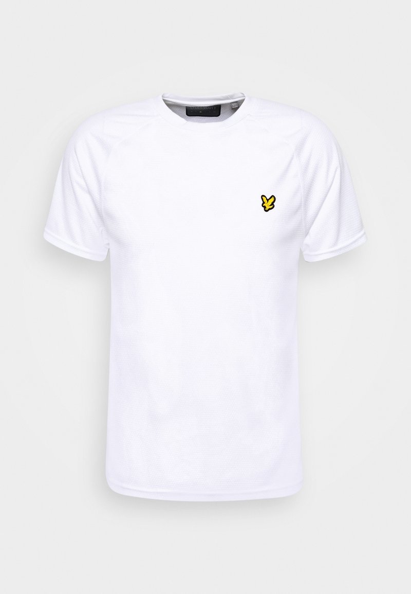 Vit kortärmad T-shirt tillverkad av texturerat tyg, med en liten broderad logotyp i gult på vänster bröst. Rund halsringning.