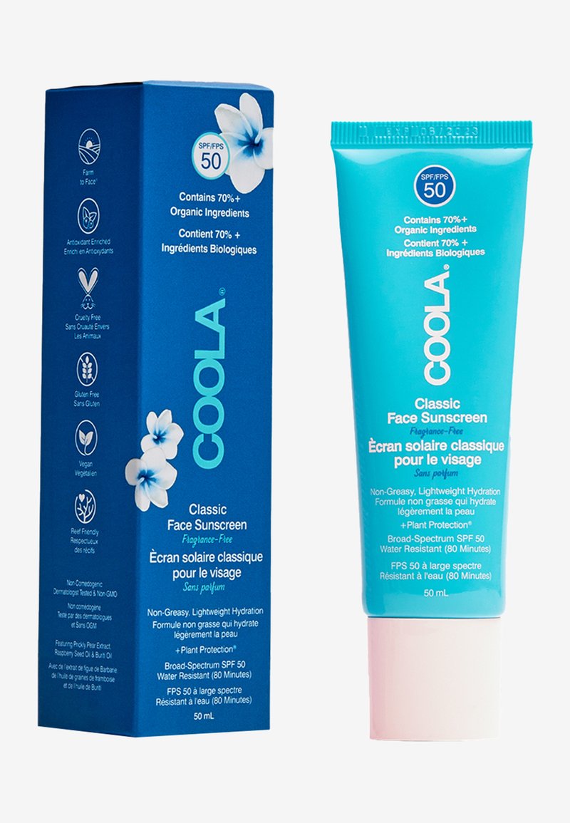 Krem przeciwsłoneczny Coola Classic Face, SPF 50, w turkusowej tubie z białym napisem. Pudełko zdobią kwiatowe grafiki oraz ikony ekologiczne.