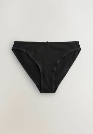 Bañador tipo bikini negro con textura suave, cintura delgada y detalles de encaje en los bordes. Presenta un lazo central.
